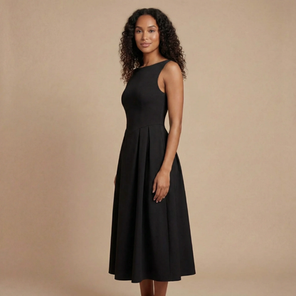 Side view of black midi dress with boat neckline and full A-line skirt