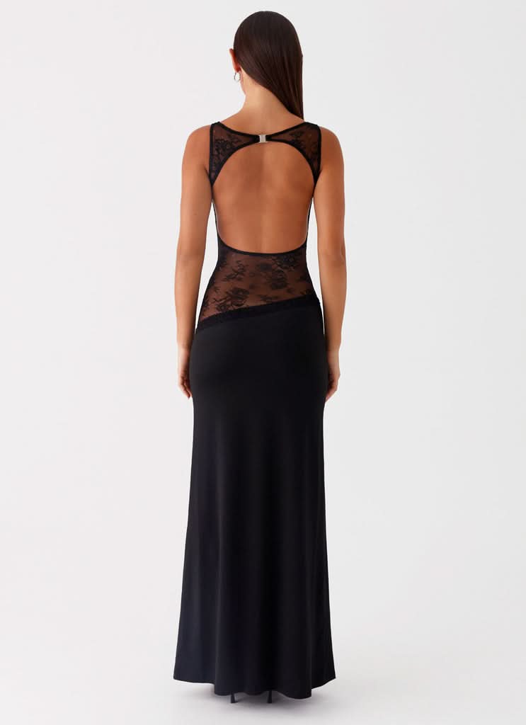 Black maxi dress with open back cutout and lace waist detail