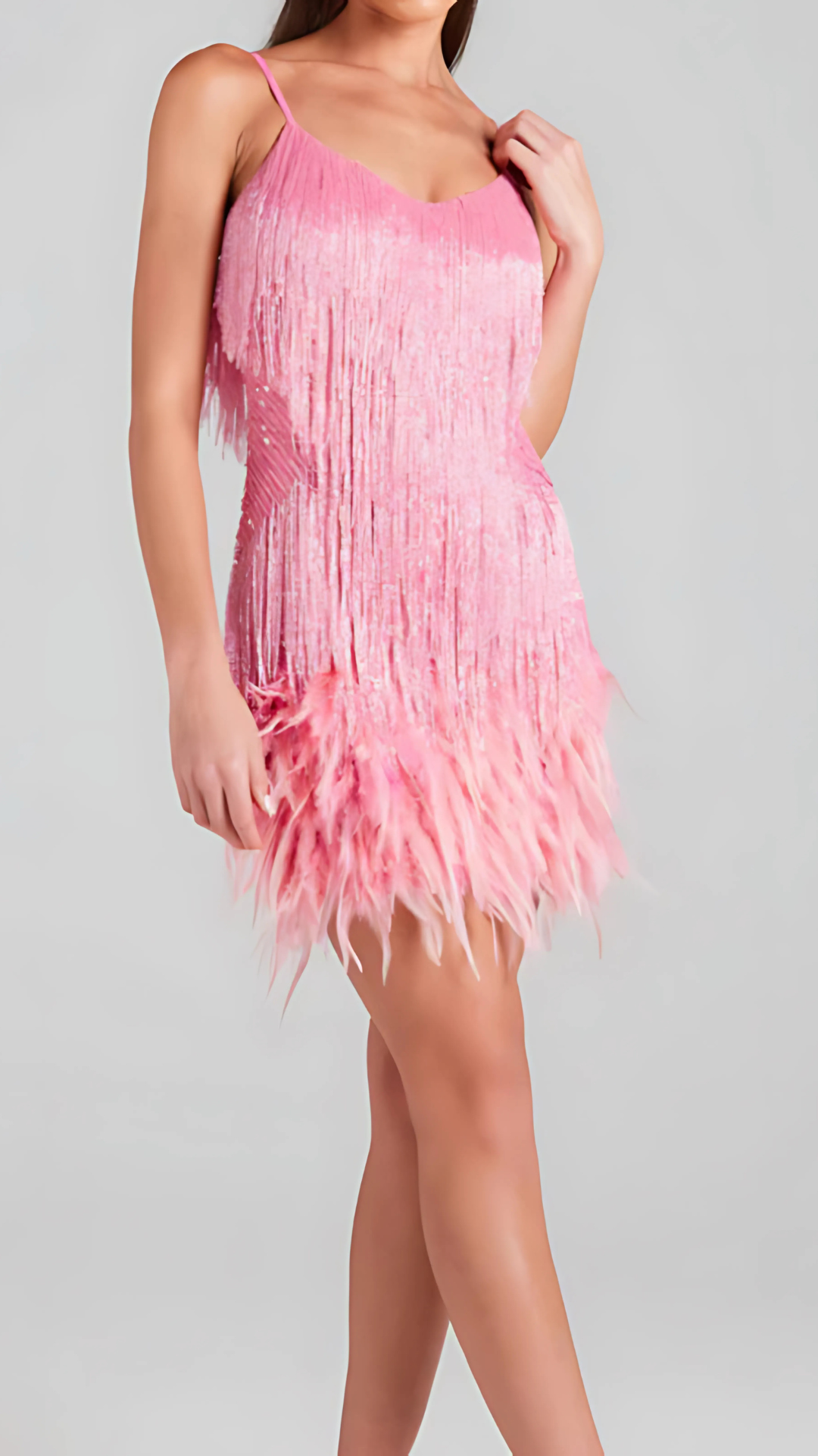 Side view of pink sequin fringe cocktail dress with v-neckline