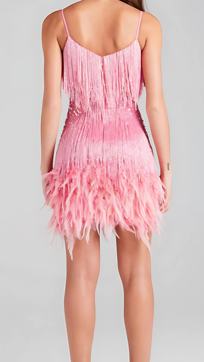 Back view of pink sequin fringe mini dress showing v-back design