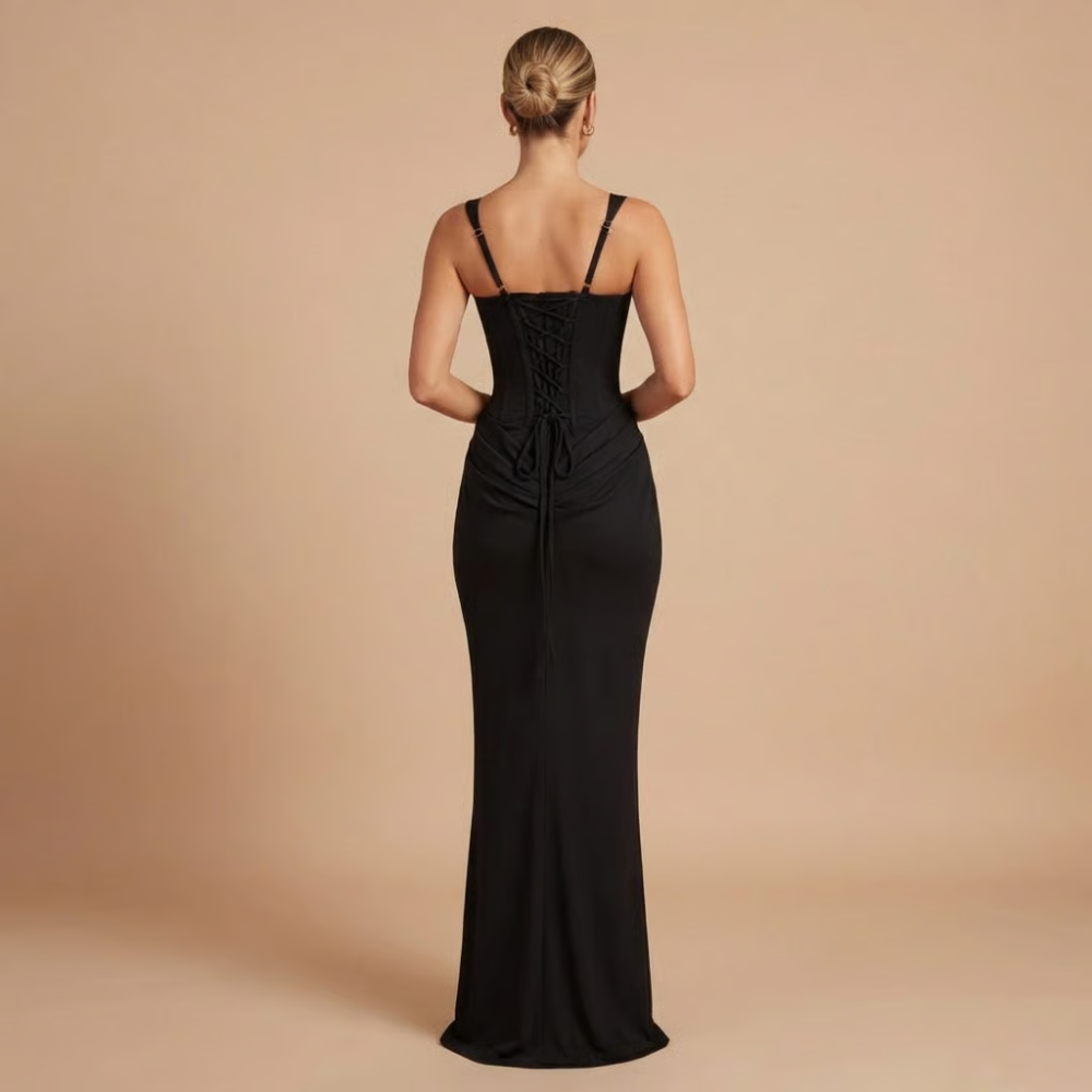 Back view of black square neck dress showing lace-up corset back