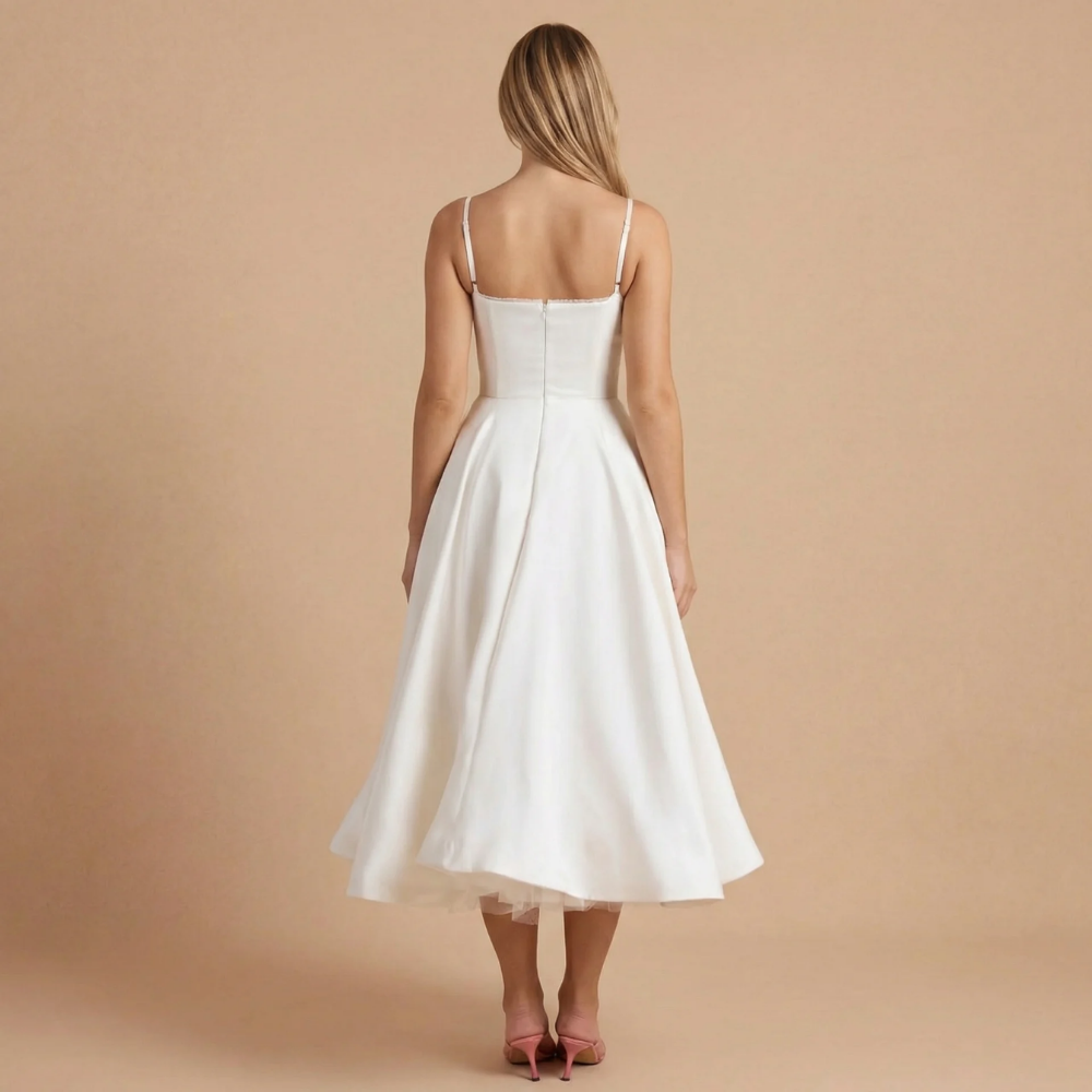 Back view of ivory A-line midi dress with thin straps