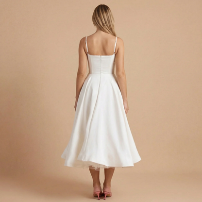 Back view of ivory A-line midi dress with thin straps