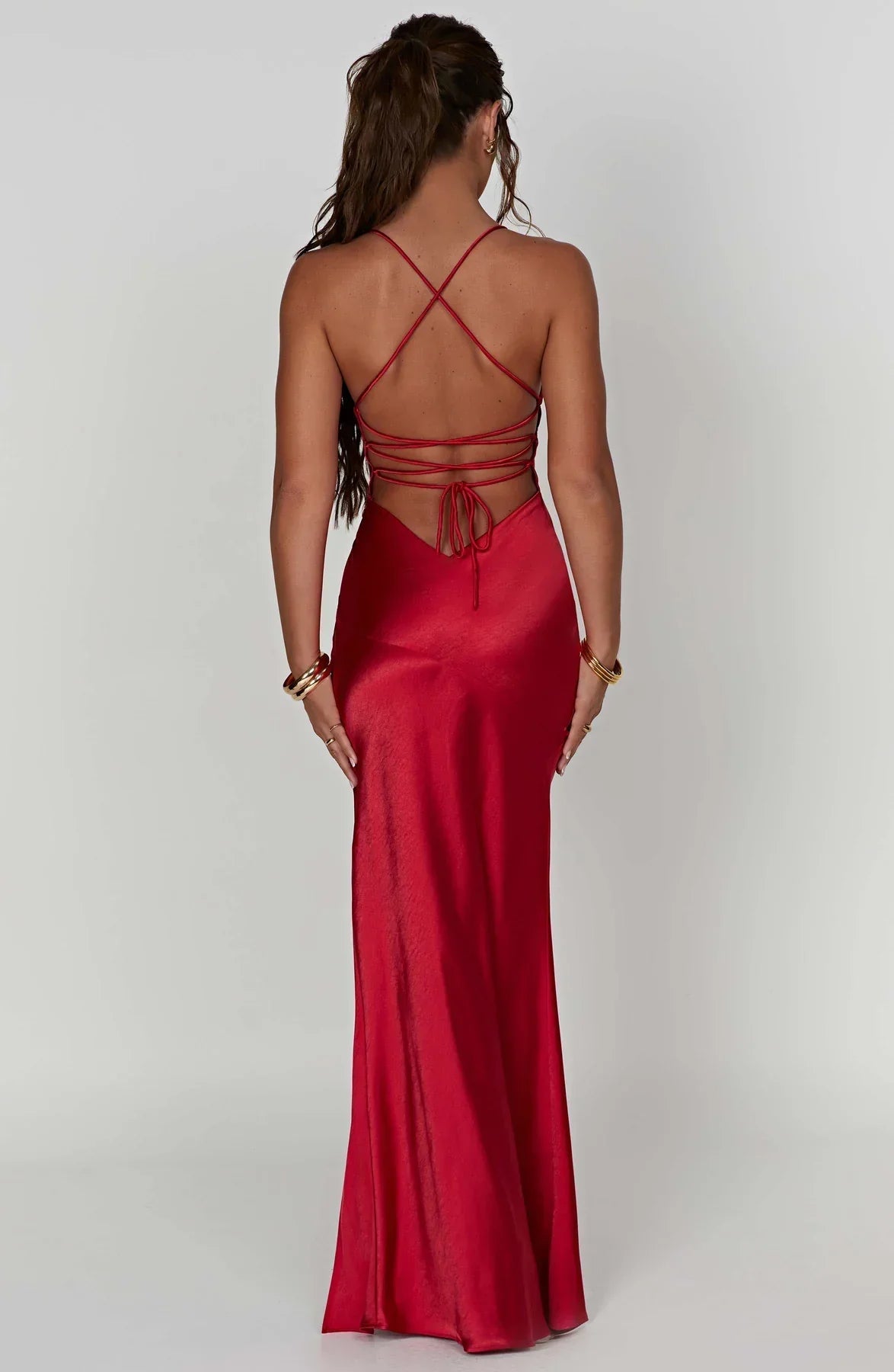 Back view of red maxi dress with criss-cross straps and tie detail