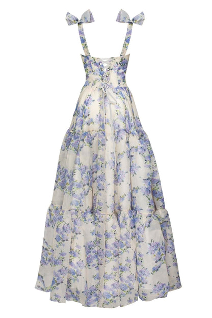 Back view of formal floral maxi dress with lace-up corset and tiered skirt