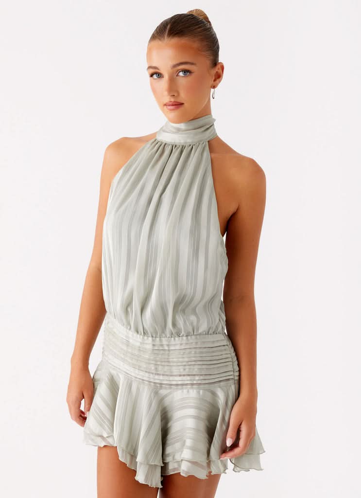 Sage green halter neck pleated dress front view with ruched waist