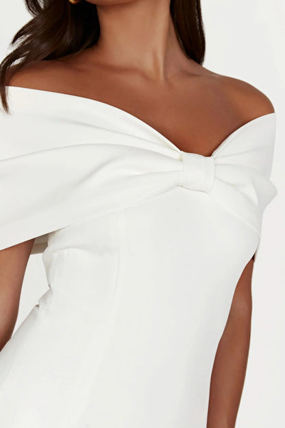 Close-up of white off-shoulder bow neckline with tie detail