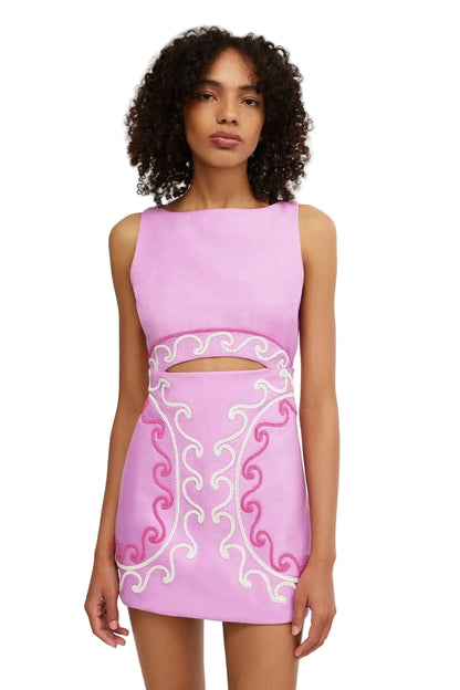Pink sleeveless mini dress with ornate scroll embroidery and cut-out waist detail