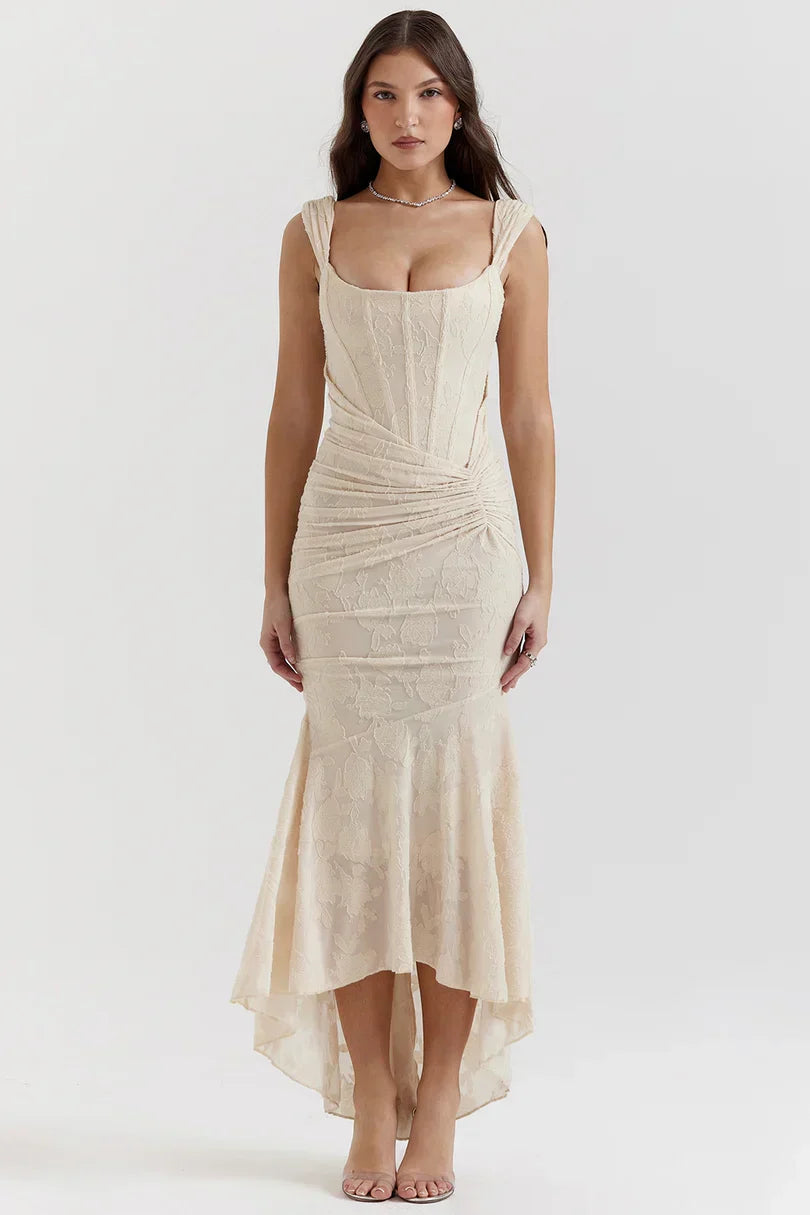 Front view of cream corset midi dress with asymmetrical hemline detail
