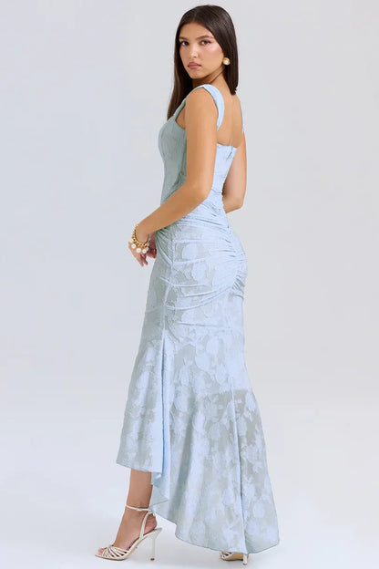 Back view of light blue floral maxi dress showing ruched corset detail