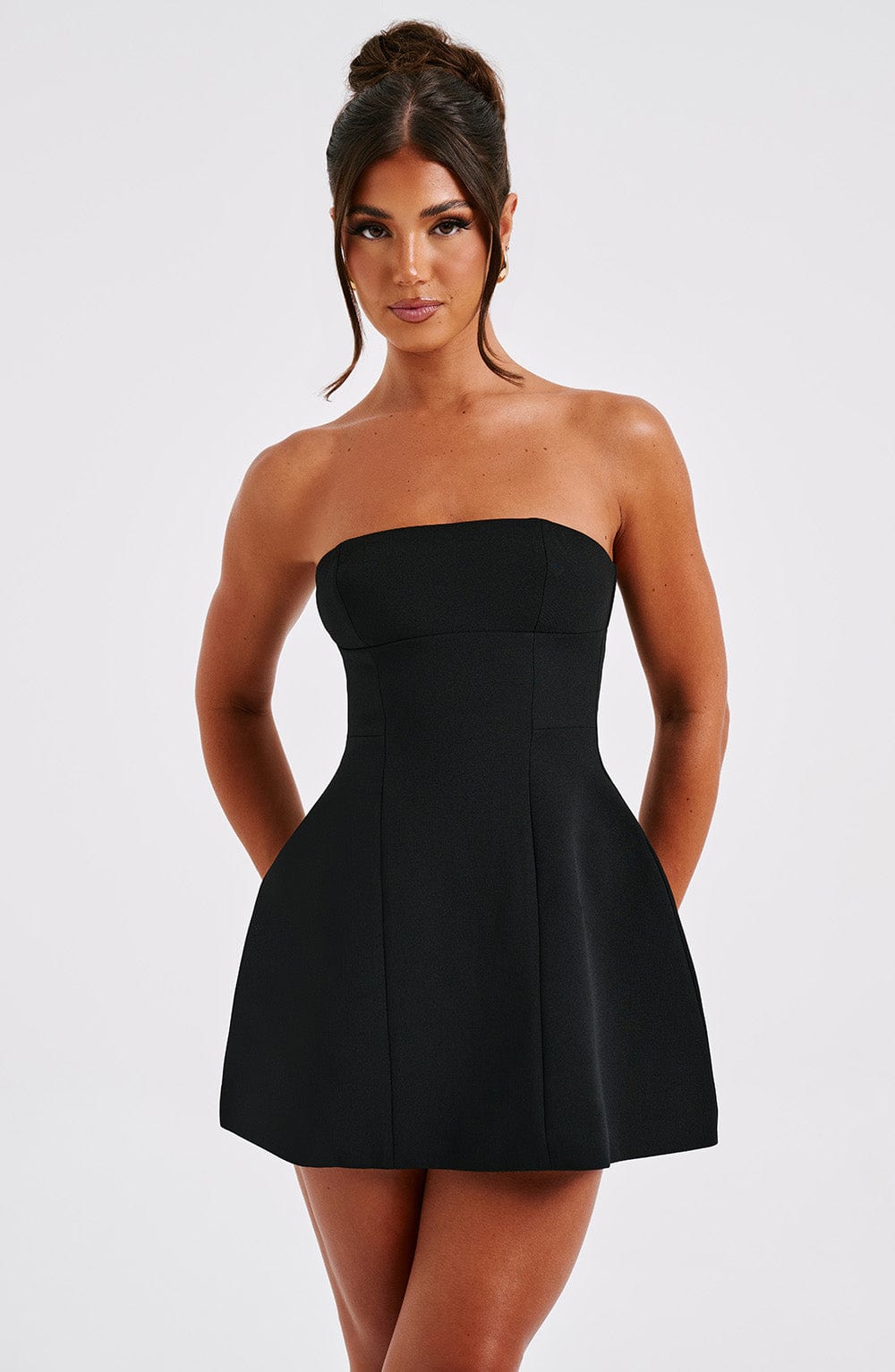 Black strapless bubble dress front view with fitted bodice and pockets