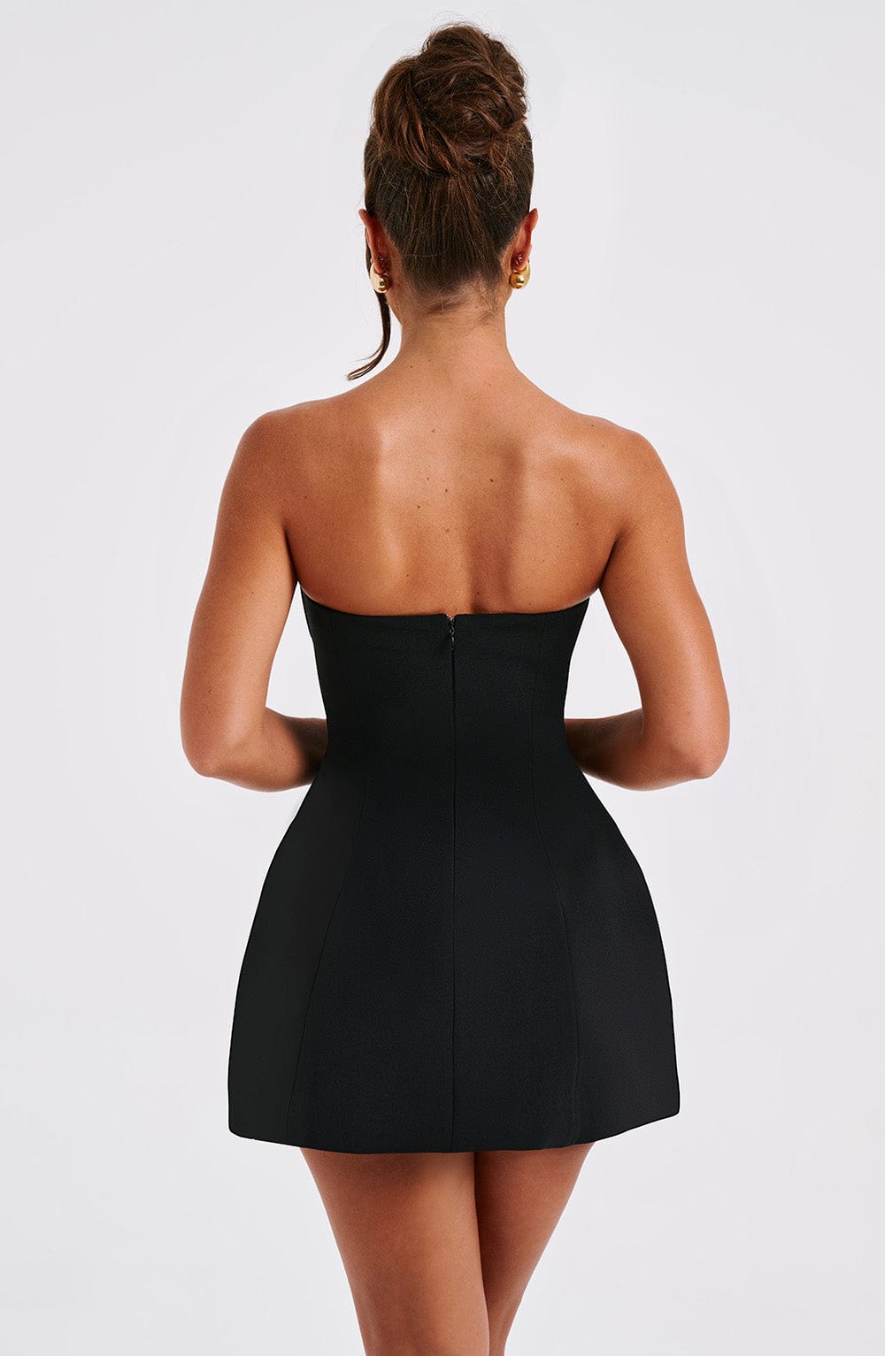 Black strapless bubble mini dress back view with center seam detail