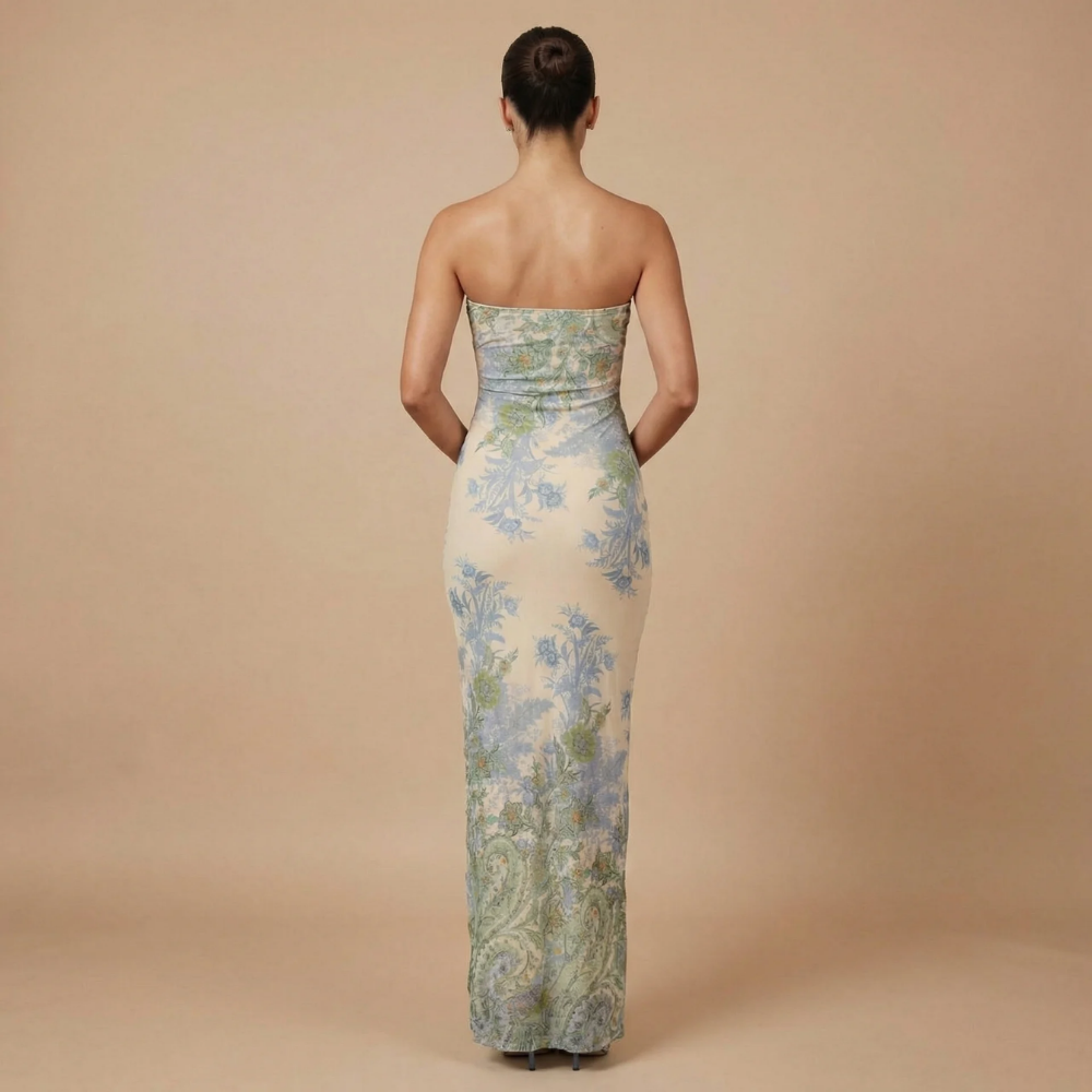 Back view of strapless floral midi dress showing fitted bodice and ruffle slit detail