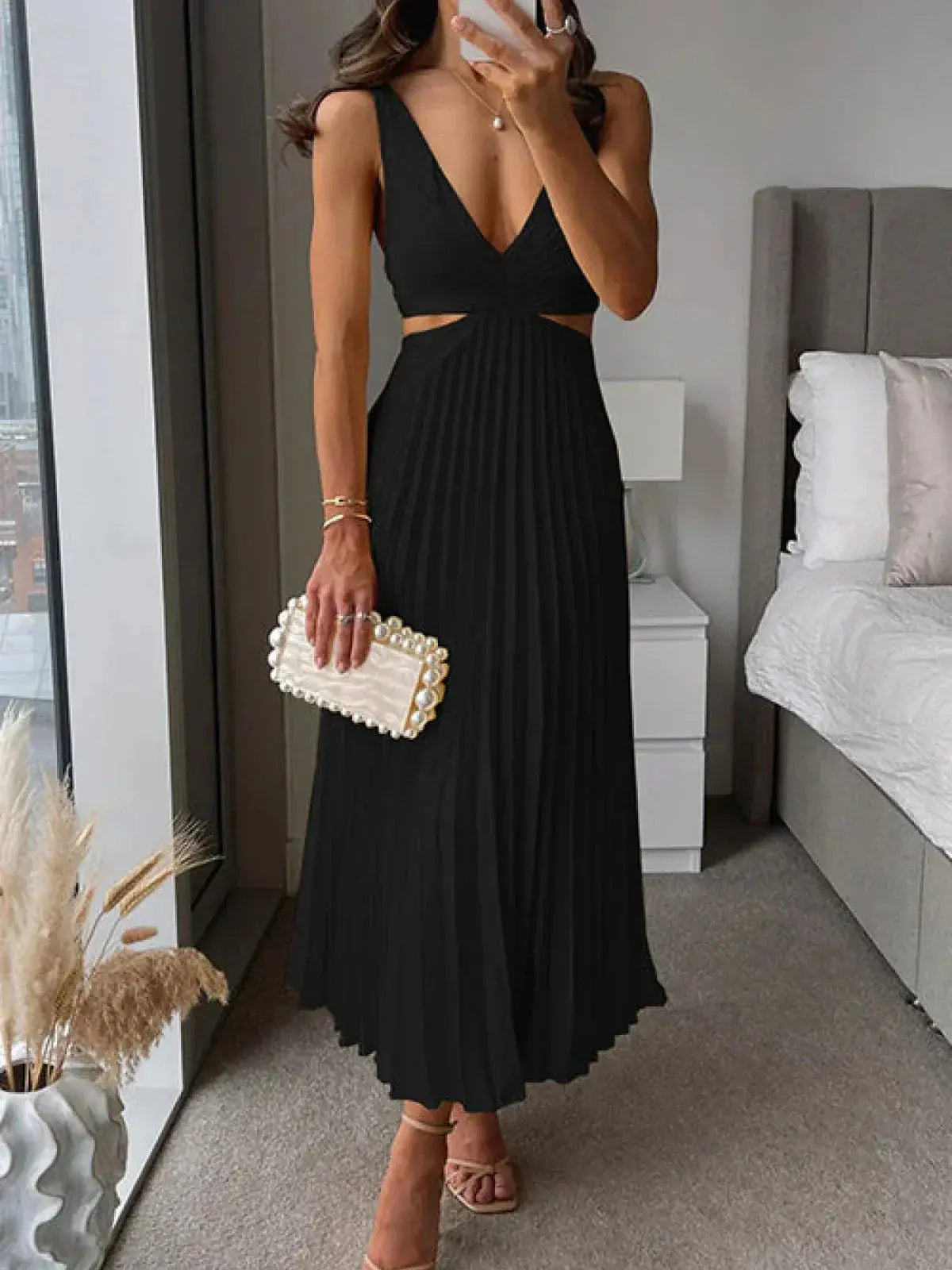 Black v-neck pleated midi dress with side cut-out and ruched bodice