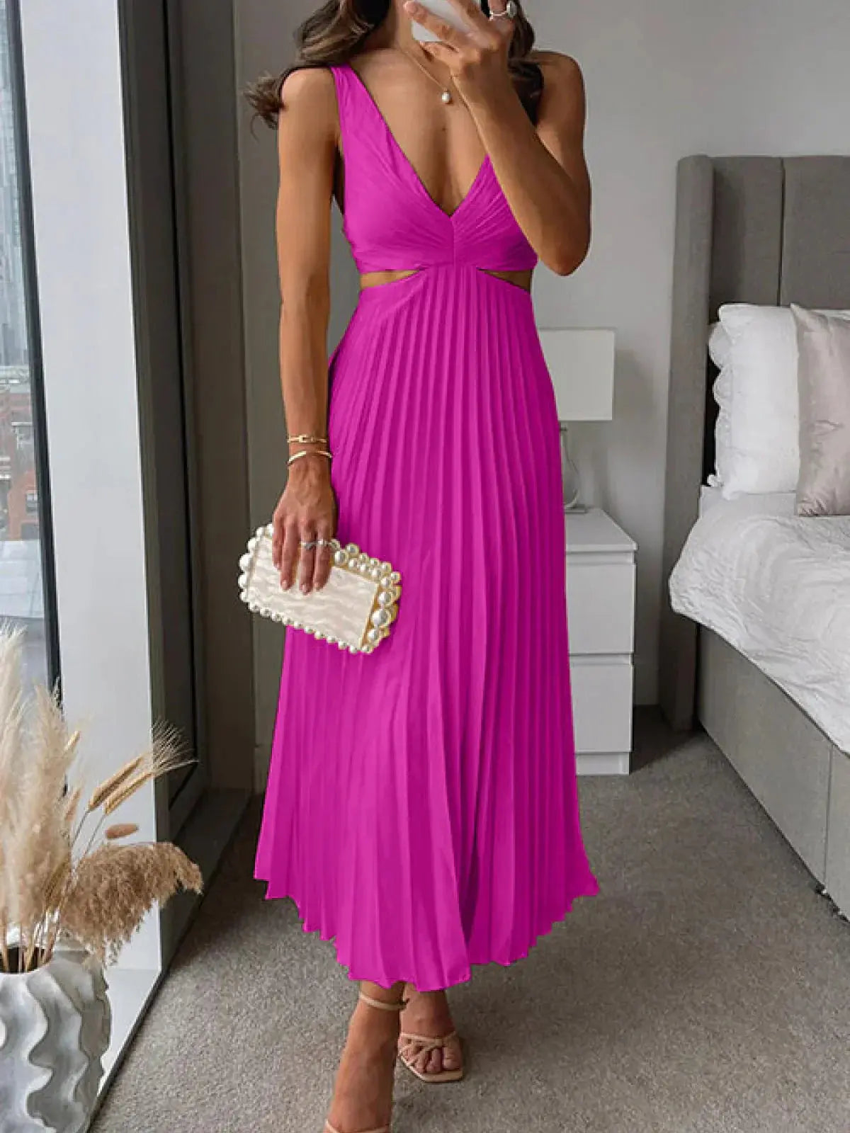 Magenta pleated midi dress with deep v-neck and cut-out waist