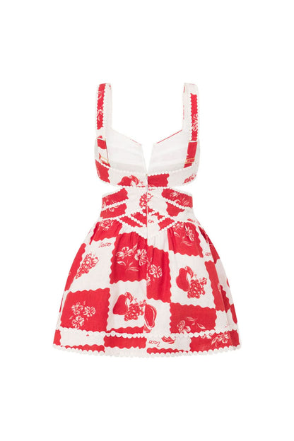 Back detail of red floral mini dress showing pearl-beaded cutout pattern