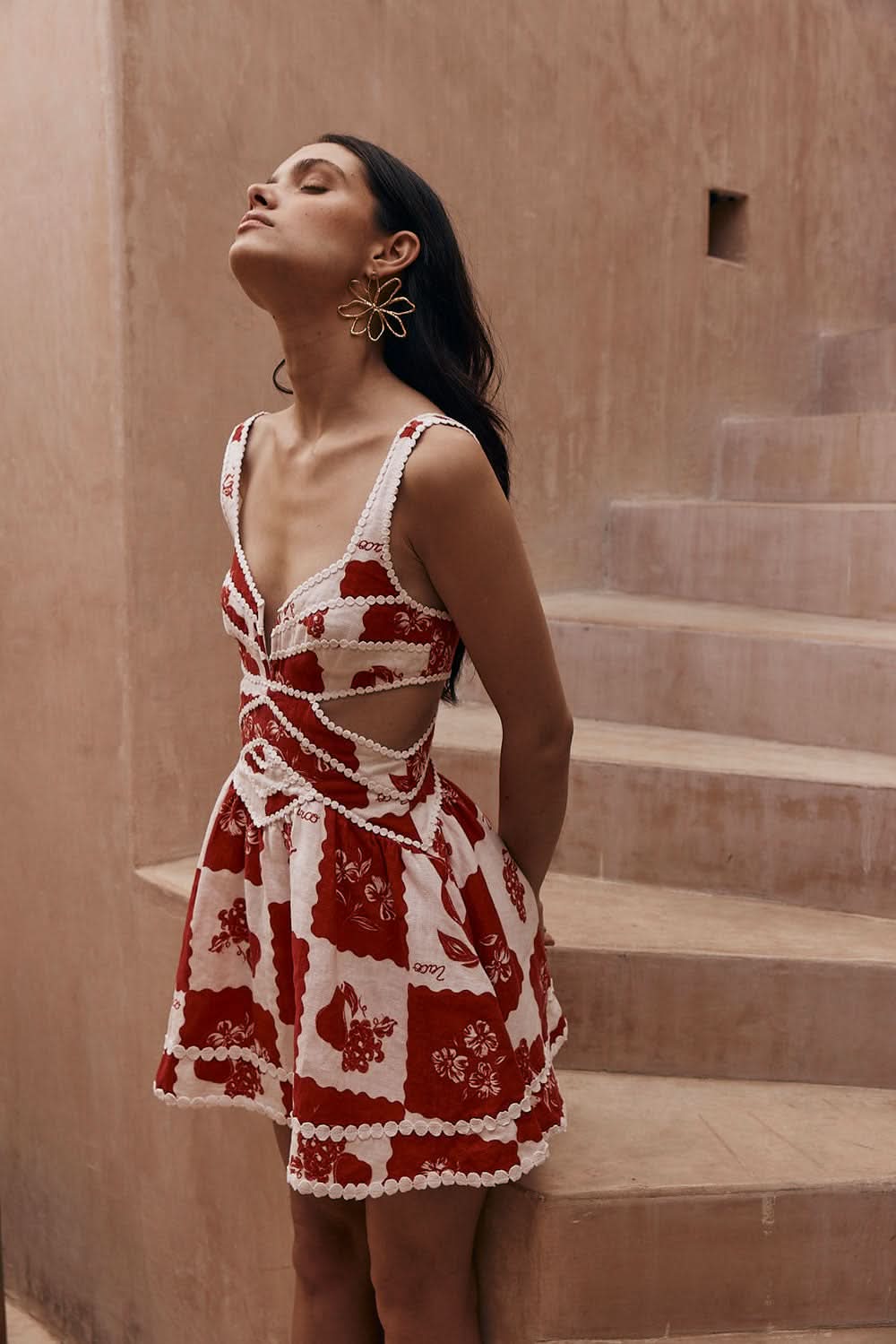 Red and white floral mini dress with v-neck and pearl beaded cutout details