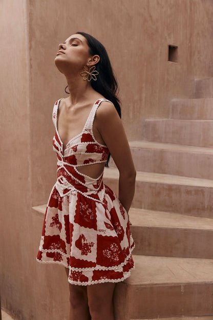 Red and white floral mini dress with v-neck and pearl beaded cutout details