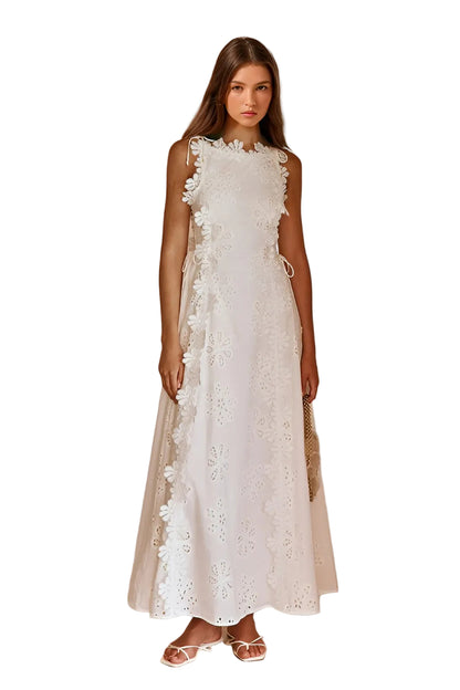 White eyelet lace maxi dress with ruffled trim and side lace-up detail