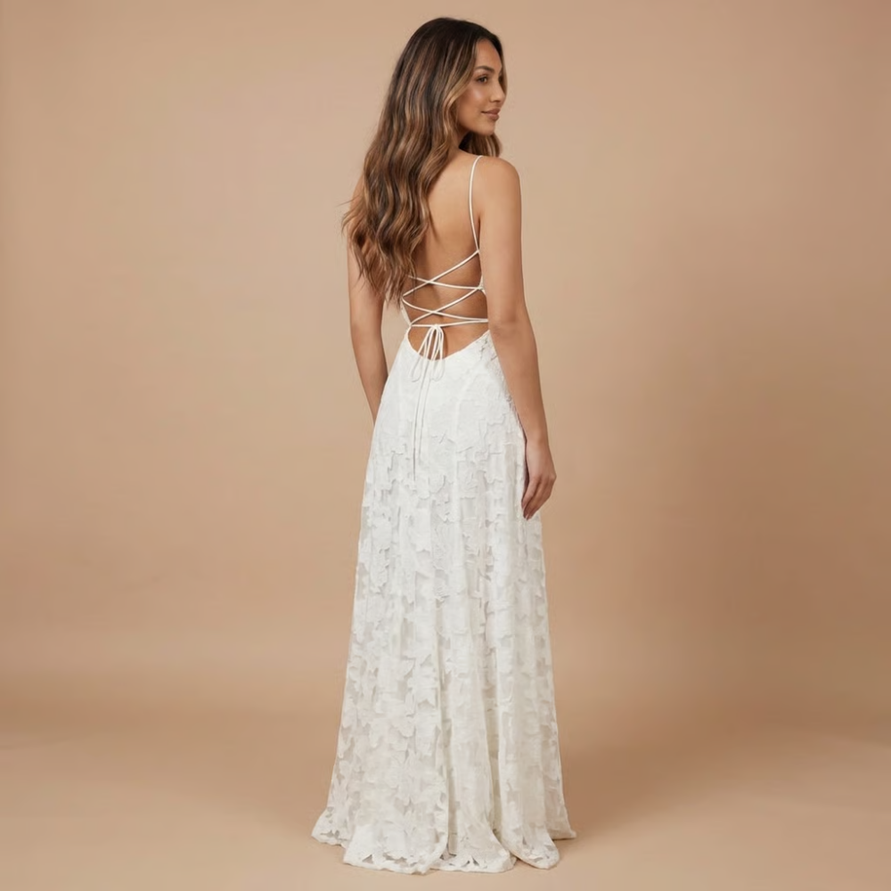 Back view of ivory lace maxi dress showing lace-up strappy back design