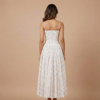 Back view of cream floral midi dress with thin straps
