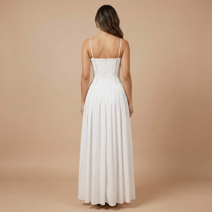 Back view of white midi dress with thin straps and gathered waist detail
