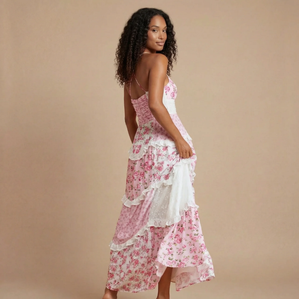 Women's pink floral maxi dress back view showing criss-cross spaghetti straps