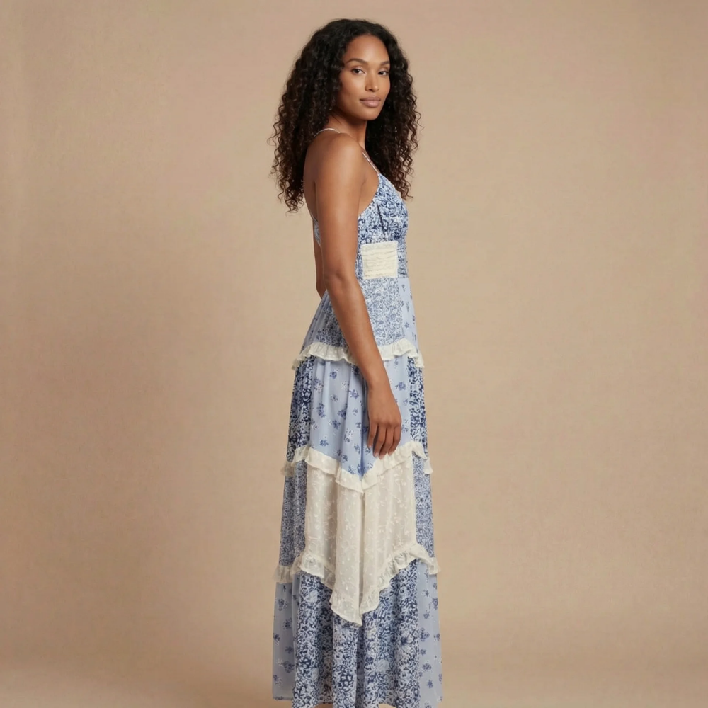 Women's blue floral maxi dress side profile with smocked waist and tiered ruffles