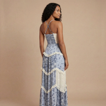 Women's blue floral maxi dress back showing criss-cross strap construction