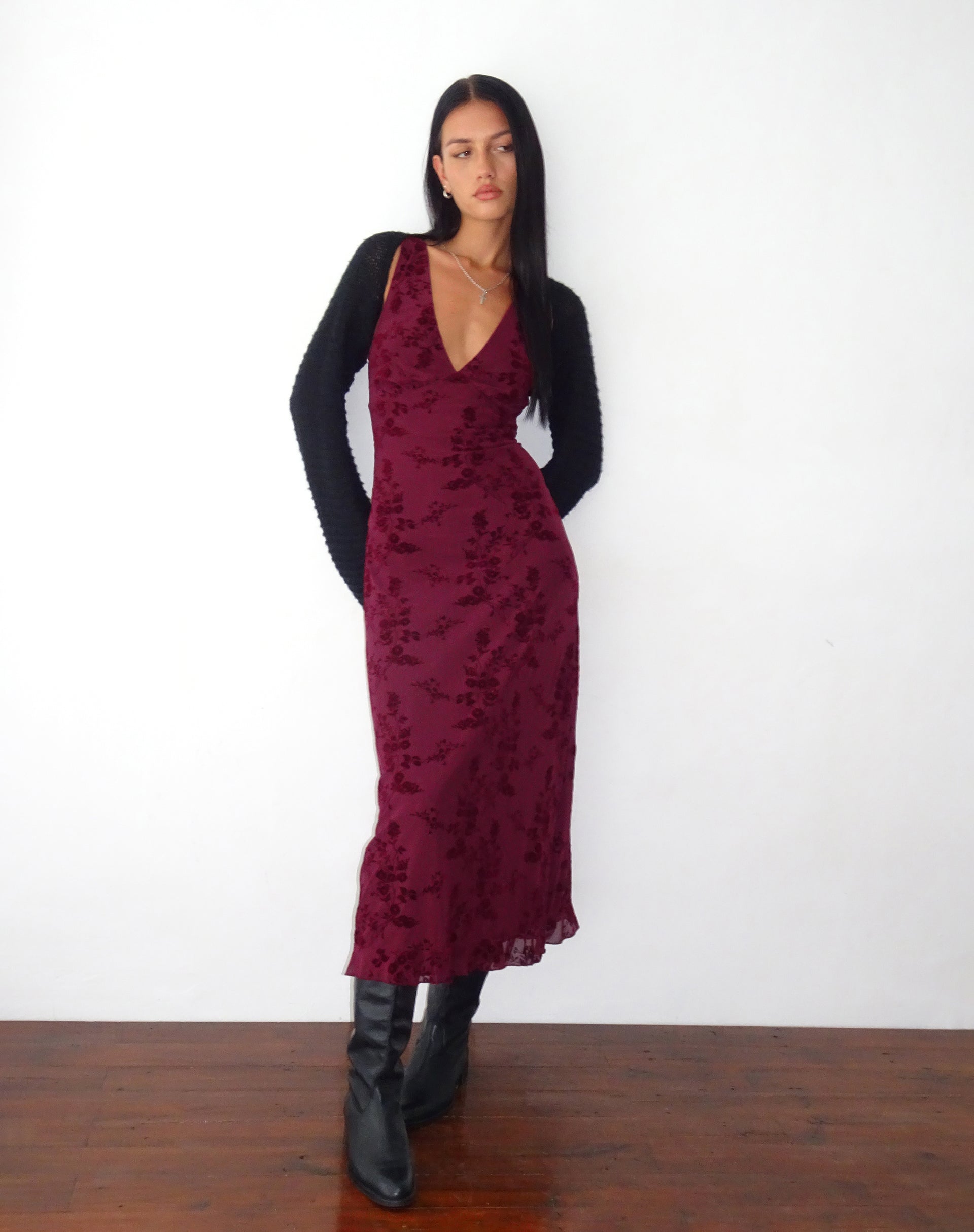 Burgundy floral midi dress styled with black cardigan and black boots