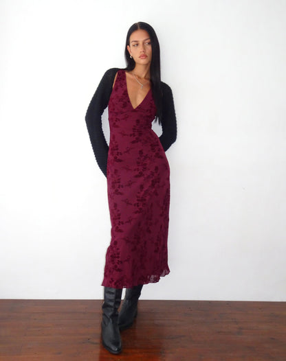 Burgundy floral midi dress styled with black cardigan and black boots