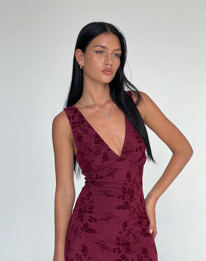 Close-up of burgundy floral midi dress V-neckline and velvet texture detail