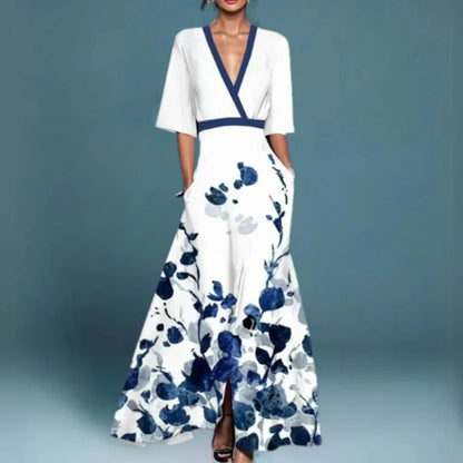White maxi dress with navy blue floral print, v-neck, half sleeves, and side pockets