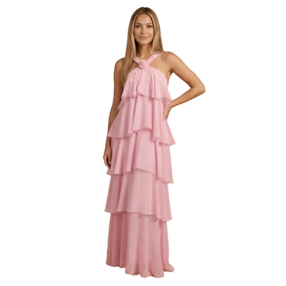 Pink halter tiered maxi dress with cascading ruffled layers and twisted neckline