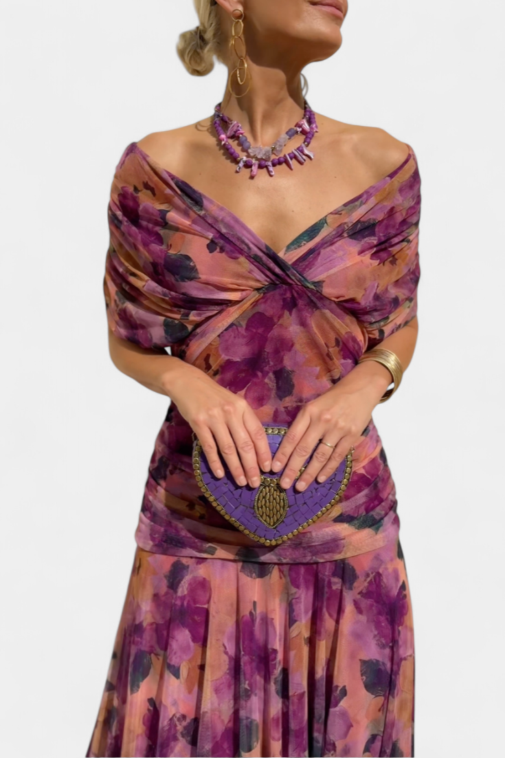 Front close-up of off-shoulder ruched wrap neckline on purple floral midi dress