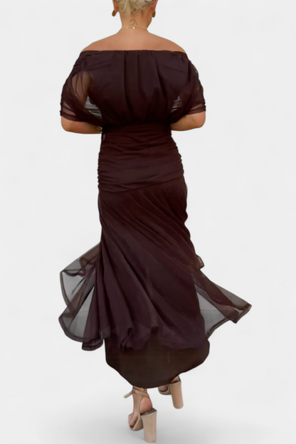 Rear angle of brown off-shoulder dress showing ruched waist and train