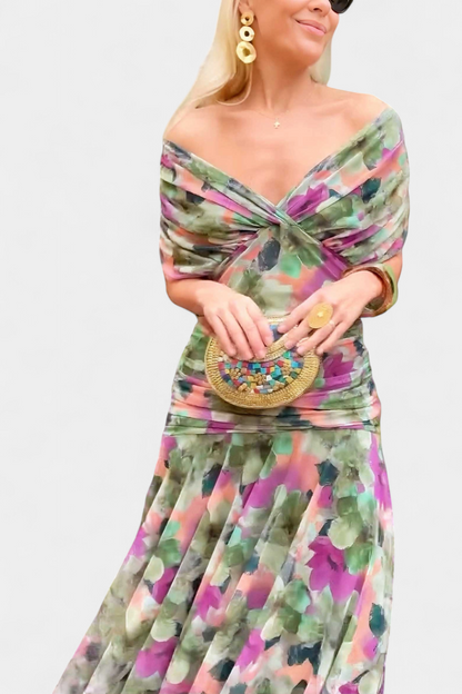 Front view of watercolor floral ruched midi dress in vibrant pink and green