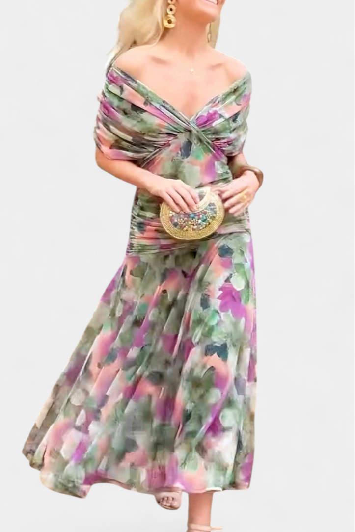 Back view of multicolor floral ruched midi dress with dramatic train