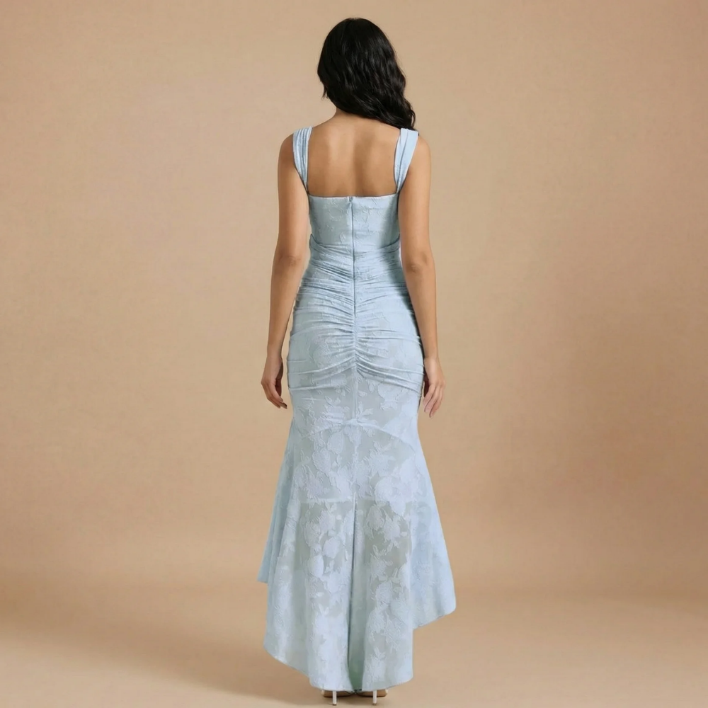 Back view of light blue jacquard maxi dress showing ruched seaming and high-low hem
