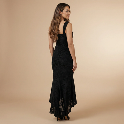 Side back view of black lace ruched dress with asymmetrical hemline