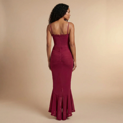 Back view of burgundy maxi dress showing open back and ruched details
