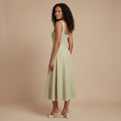 Back view of sage green midi dress showing open back design