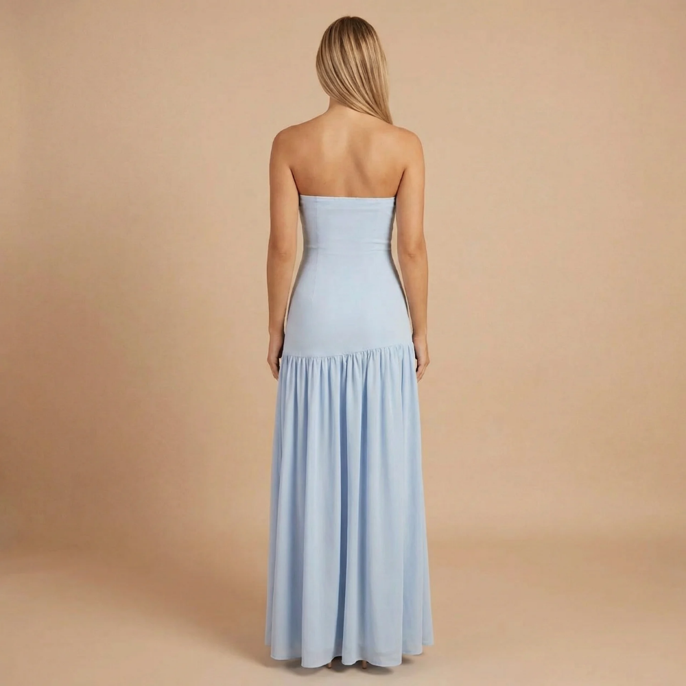 Back view of light blue strapless maxi dress with flowing skirt
