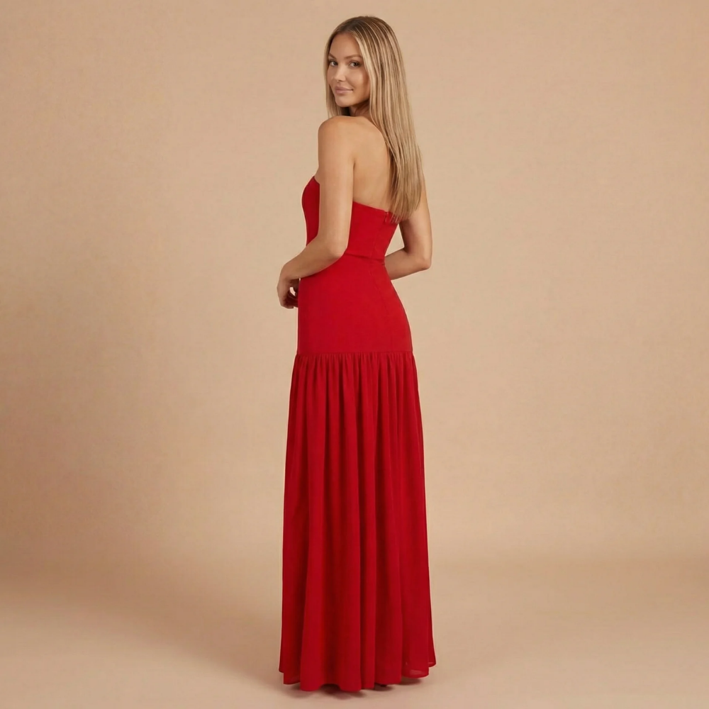 Back view of red strapless maxi dress with gathered waist