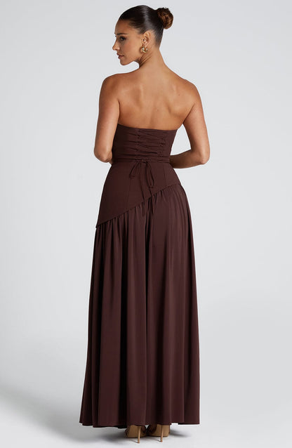 Chocolate brown strapless maxi dress with ruched waist and high leg slit, back view