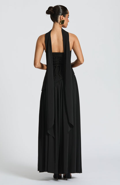 Black strapless maxi dress with ruched bodice and high slit, back view